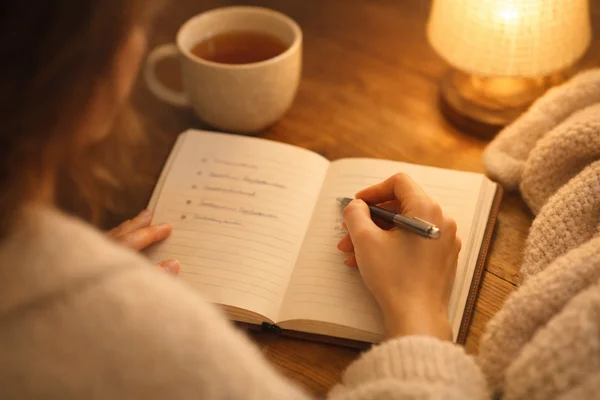 A person journaling, representing a self-reflection checklist on BPD patterns